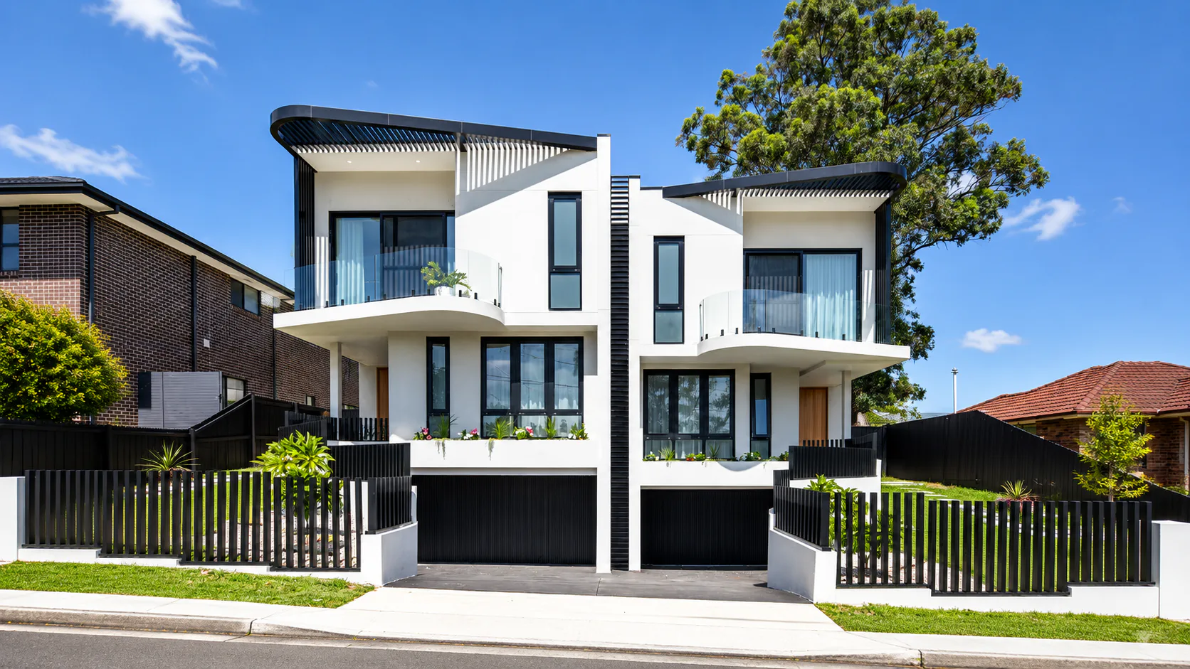 Contemporary courtyard connected to the interior by large glazed doors
